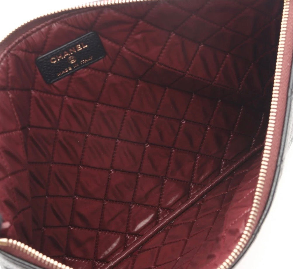 Chanel O Case clutch in black quilted caviar leather