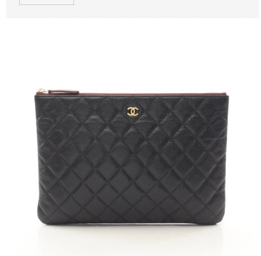 Chanel O Case clutch in black quilted caviar leather