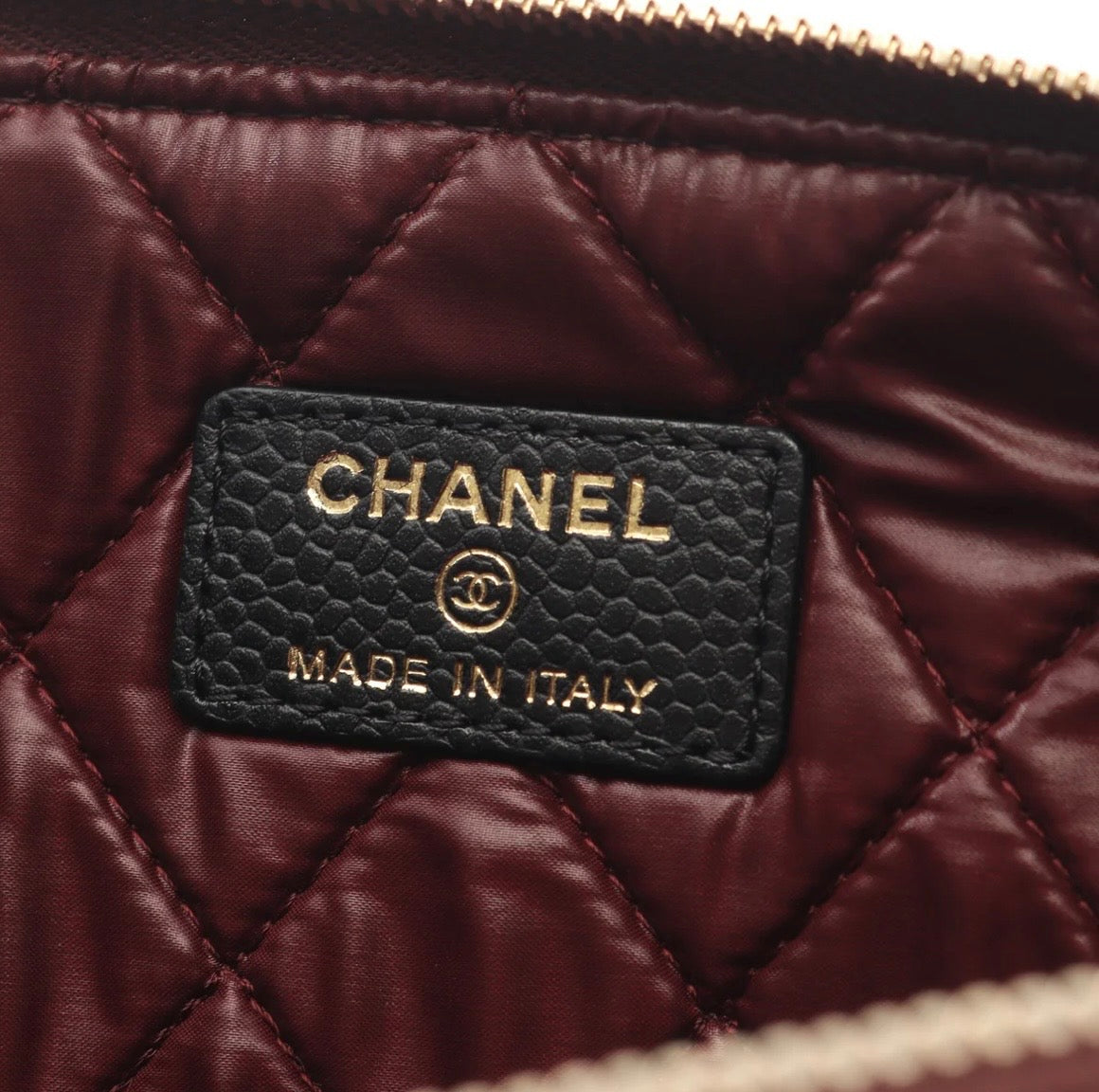 Chanel O Case clutch in black quilted caviar leather