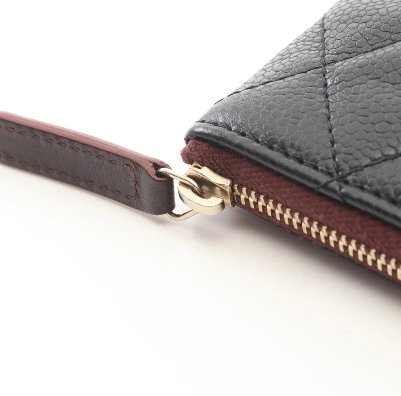 Chanel O Case clutch in black quilted caviar leather